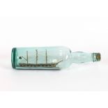 A finely modelled Antique ship in a bottle, depicting a three mast Man-O-War, 31cm