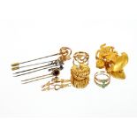 A yellow metal ear-ring, marked 750 4gms; two 9ct gold rings 5gms total; a 9ct gold mounted stick