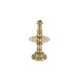 A 16th/17th Century Colonial Dutch turned brass pricket candlestick, with large circular central