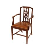 A set of eight early 20th Century mahogany dining chairs, having pierced backs, leather