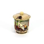 A late 19th Century porcelain pot and cover, decorated with scene of an inn and windmill in the