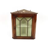 A 19th Century mahogany and glazed hanging corner display cabinet