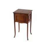 An Edwardian mahogany sewing table, the folding top opening to reveal a silk lined and fitted