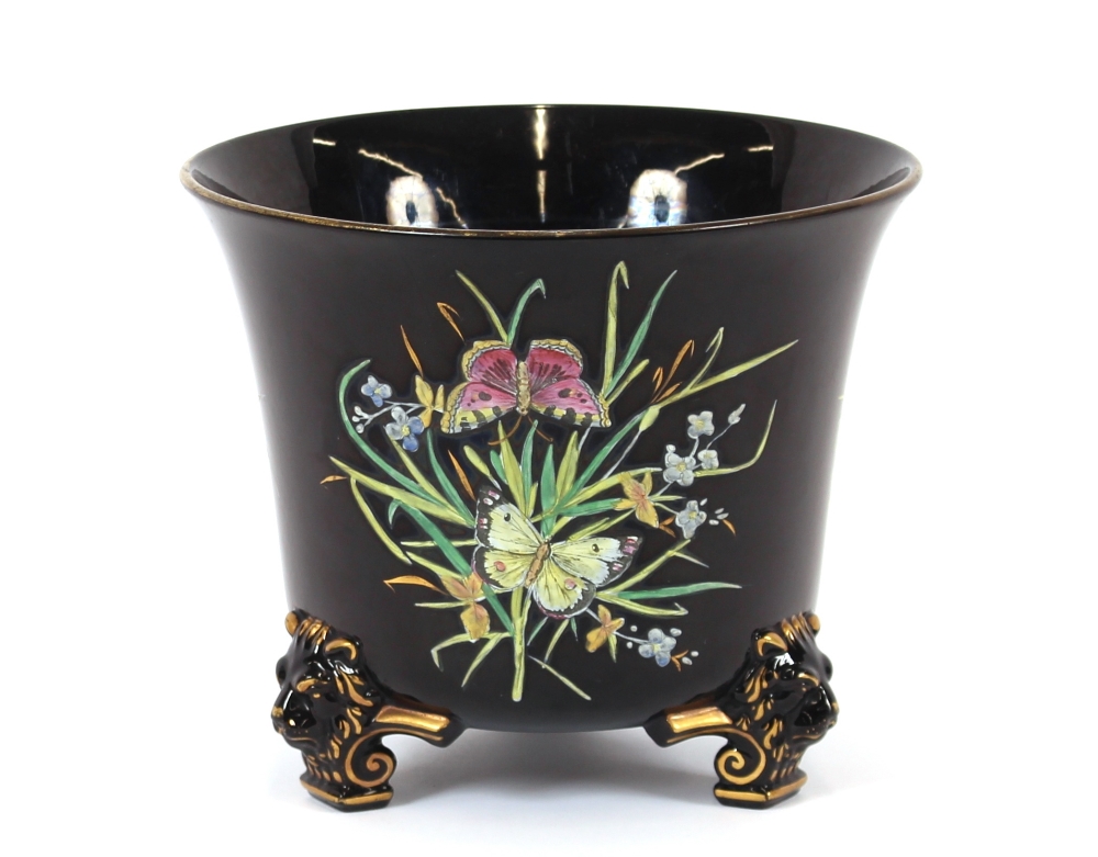 A 19th Century pottery and enamel decorated jardiniere, having profuse panels of butterflies amongst