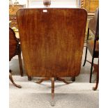 A Georgian mahogany rectangular snap top occasional table, raised on a turned baluster column and