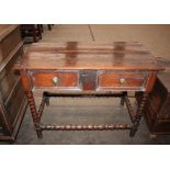 An Antique oak side table, fitted single drawer with iron lock-plate and brass pear-drop handles,