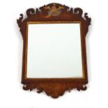 A 19th Century mahogany Chippendale style wall mirror, the fret carved pediment with gilt Ho Ho bird