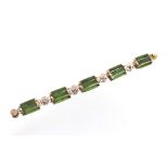 A gilt metal and jade bracelet