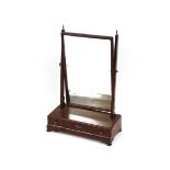 A 19th Century mahogany swing toilet mirror, the oblong plate raised on tapering arms surmounted