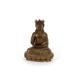 An Oriental bronzed figure, depicting a young seated Buddha, 25cm high