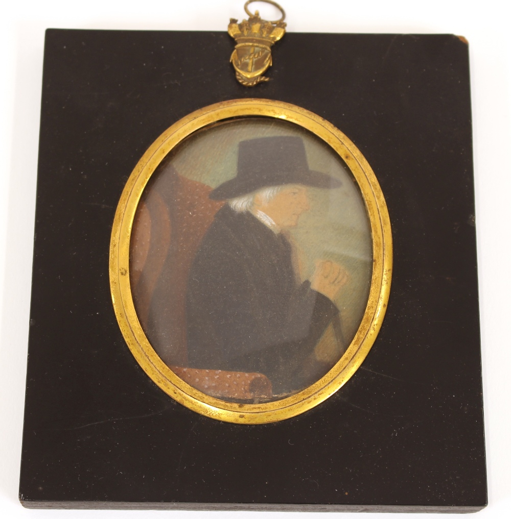 A 19th Century miniature portrait, of a gentleman in black coat and hat, contained in an ebonised