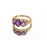 A 9 carat gold three stone amethyst set ring