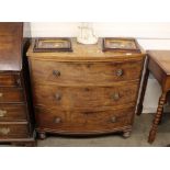 A 19th Century mahogany bow fronted chest, fitted three long drawers, raised on turned supports,