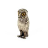 A Victorian silver plated owl shaped pepper, with amber glass eyes and chase work feathers, 7.5cm