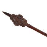 A finely carved and well patinated wooden sceptre, with carved birds, roundels and snake, possibly