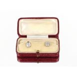 A pair of 18 carat gold diamond and mother of pearl set dress studs