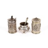 An Eastern white metal pepper pot and mustard, 7cm high; and a Chinese white metal cauldron shaped