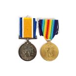 Two World War I medals, to 3551 Pte. F.E. Smith, R.A., M.C., and also Suffolk Regiment N.B.