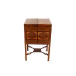 A 19th Century mahogany cross-banded and boxwood strung washstand, the hinged top opening to