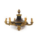 A brass and Tolware style six branch chandelier, of Empire design