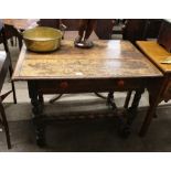 A 17th Century and later oak side table, the overhanging top above single drawer, raised on baluster