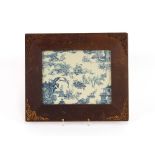 A Oriental design blue and white fabric panel, contained in a pine and gilt metal mounted frame