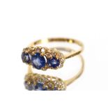 An 18 carat gold sapphire and diamond dress ring