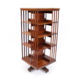 A Tees & Co. of Montreal walnut revolving bookcase, of large proportions, 60cm wide x 141cm high