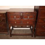 An Antique joined oak box on stand, the lid opening to reveal a fabric lined interior above mock