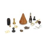 A small collection of various miniature items, including: a bone whistle, an agate seal, miniature
