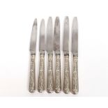 Five Edwardian silver handled steel bladed dinner knives, of large size, Sheffield 1908; six smaller