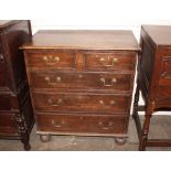 A good quality reproduction oak chest, of small proportions, fitted two short and three long