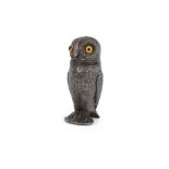 A Victorian pewter pepper, in the form of an owl with glass eyes, 8cm high