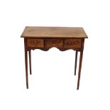 A 19th Century mahogany side table, fitted three drawers above a shaped apron and raised on tapering