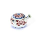 A finely painted Japanese porcelain under-glazed blue and copper red Hirado teapot, six character