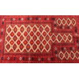 An Afghan red pattern rug, 145cm x 92cm