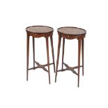 A pair Sheraton revival mahogany and inlaid oval urn stands, having pull out candle slides raised on