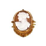 A 19th Century carved cameo shell brooch, depicting classical maiden, contained in an intricate gold
