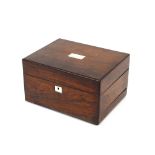 A Victorian rosewood vanity box, the hinged lid revealing a fitted interior with plated lidded