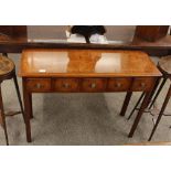 A walnut and cross banded hall table, fitted five short drawers and raised on square chamfered