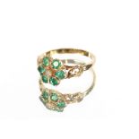A 9 carat gold emerald and diamond cluster ring