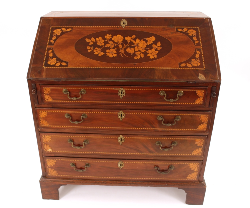 A 19th Century mahogany cross-banded and marquetry inlaid bureau, the fall front opening to reveal