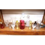 A collection of various Victorian coloured glassware, including cranberry and amethyst examples,