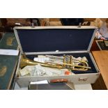 An Oxford brass trumpet with carrying case