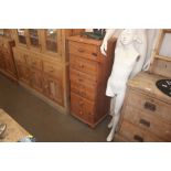 A tall pine chest of narrow proportions fitted six