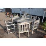 A good quality garden table with a set of eight ma