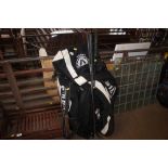 Three golf clubs and sporting bags