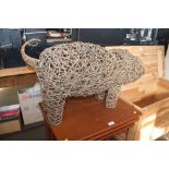 A wicker and wirework pig
