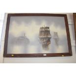 A framed oil on canvas depicting boats at sea