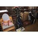 A golf bag and trolley; various clubs and balls